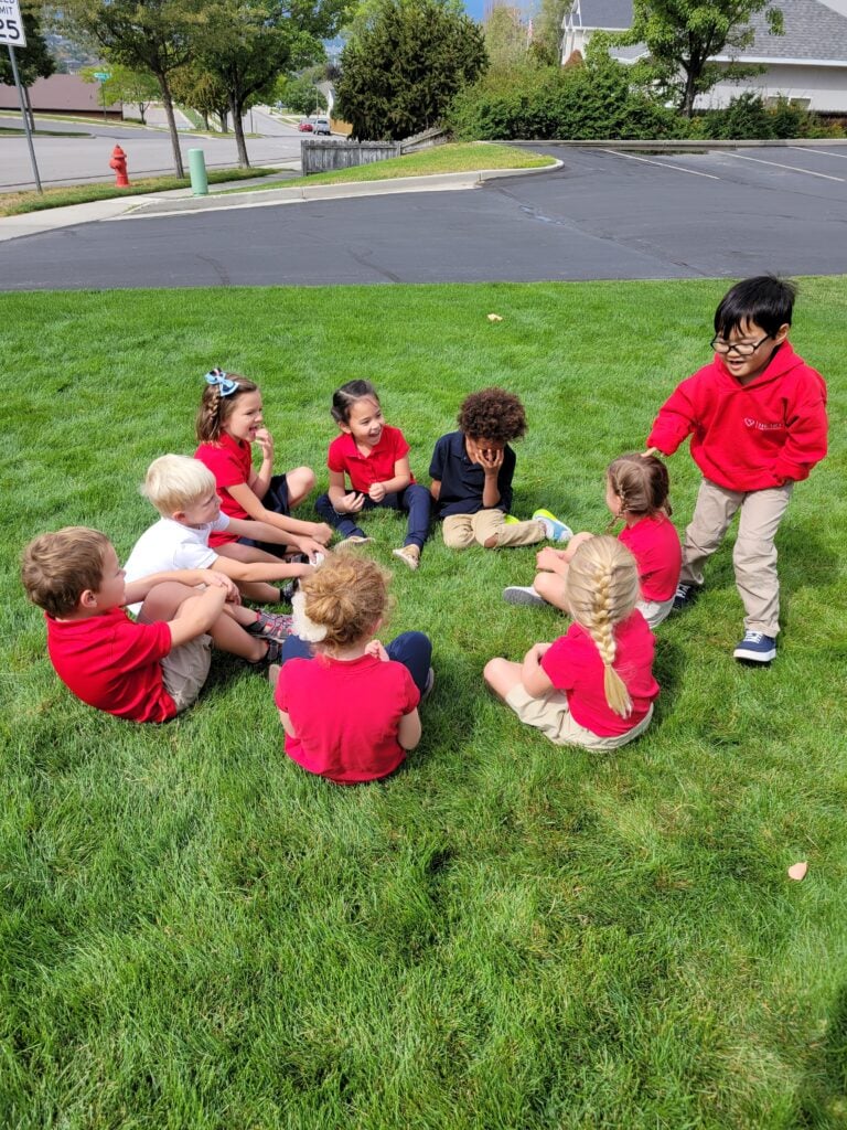 kids playing duck duck goose